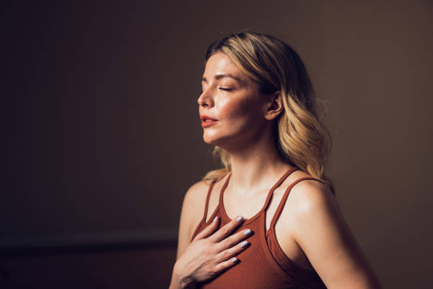 Person practising calm breathing seated